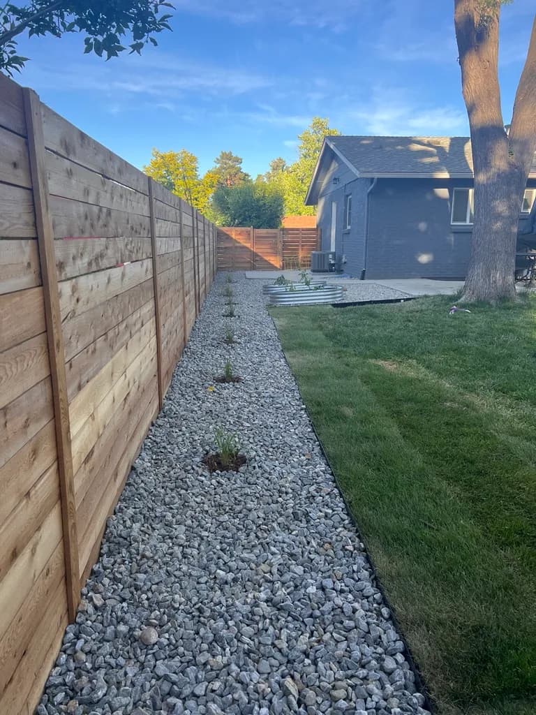 Straight, tightly-spaced horizontal cedar fence line on a Lakewood property